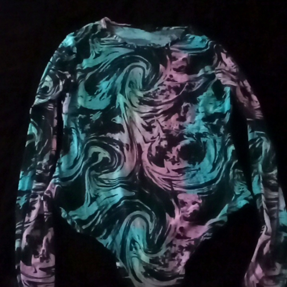 Size XL, sheer long sleeve bodysuit. Snaps at bottom.